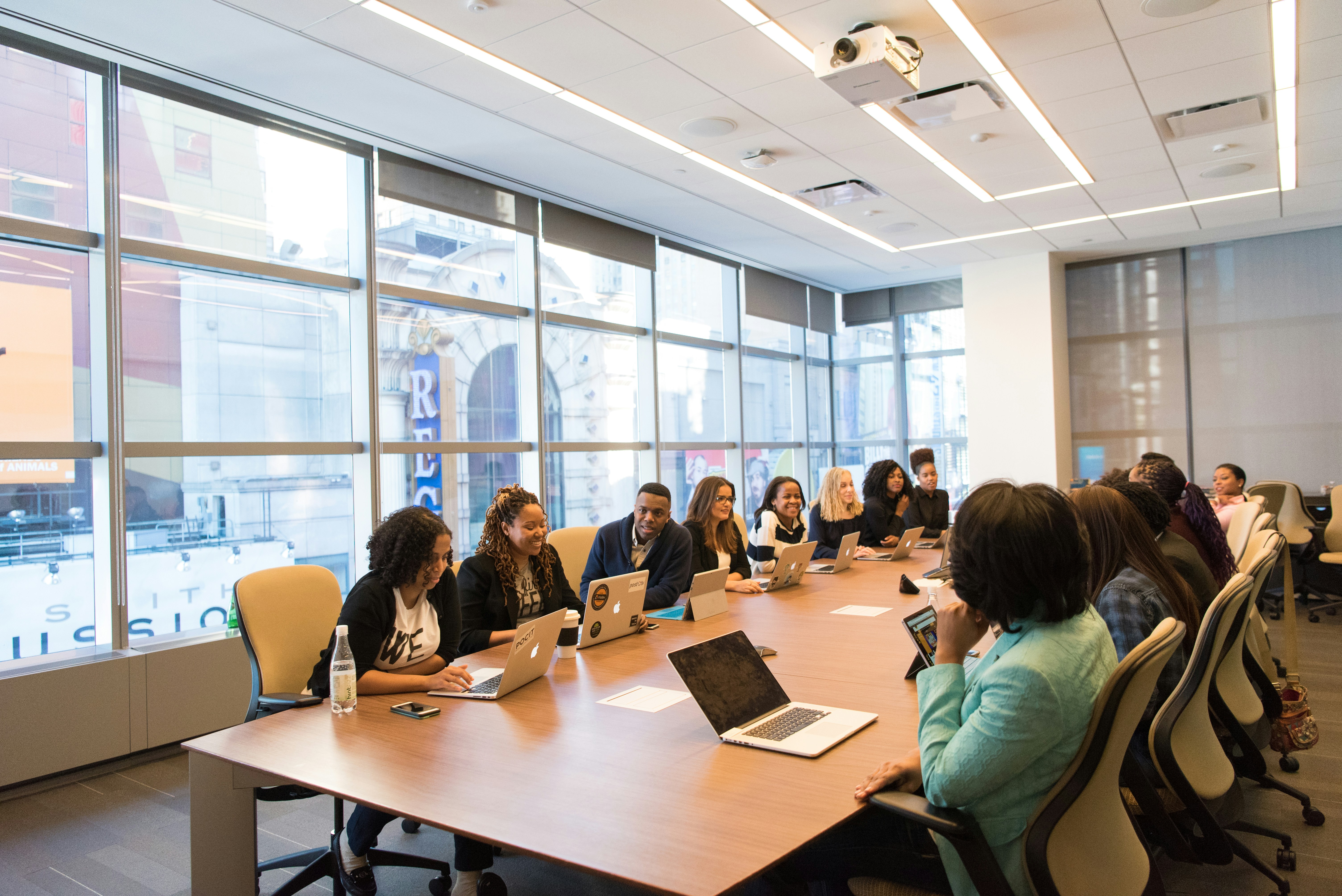 A new consultant collaborating with a client's team in a modern office