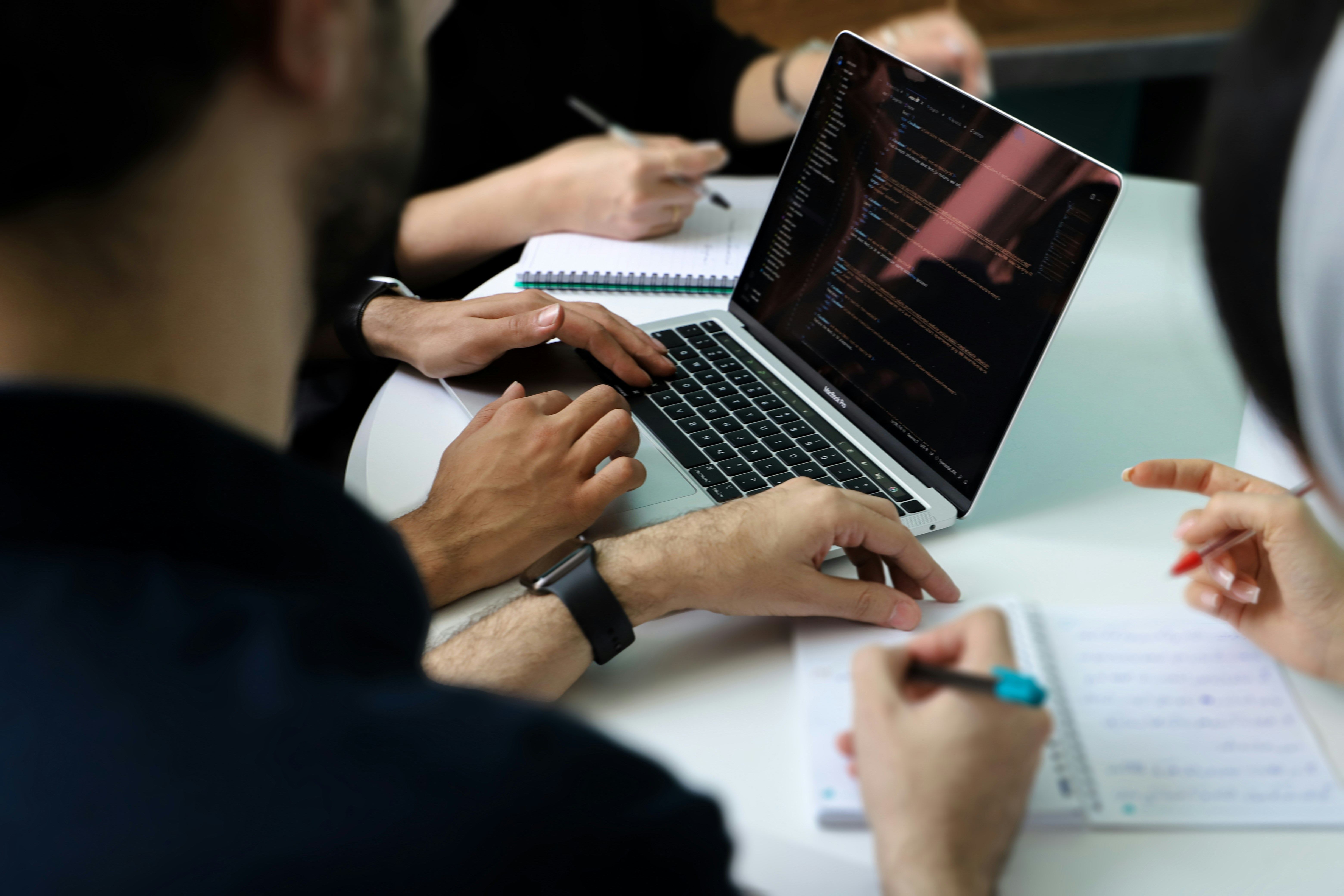 A marketing analyst reviewing customer data on a digital dashboard.