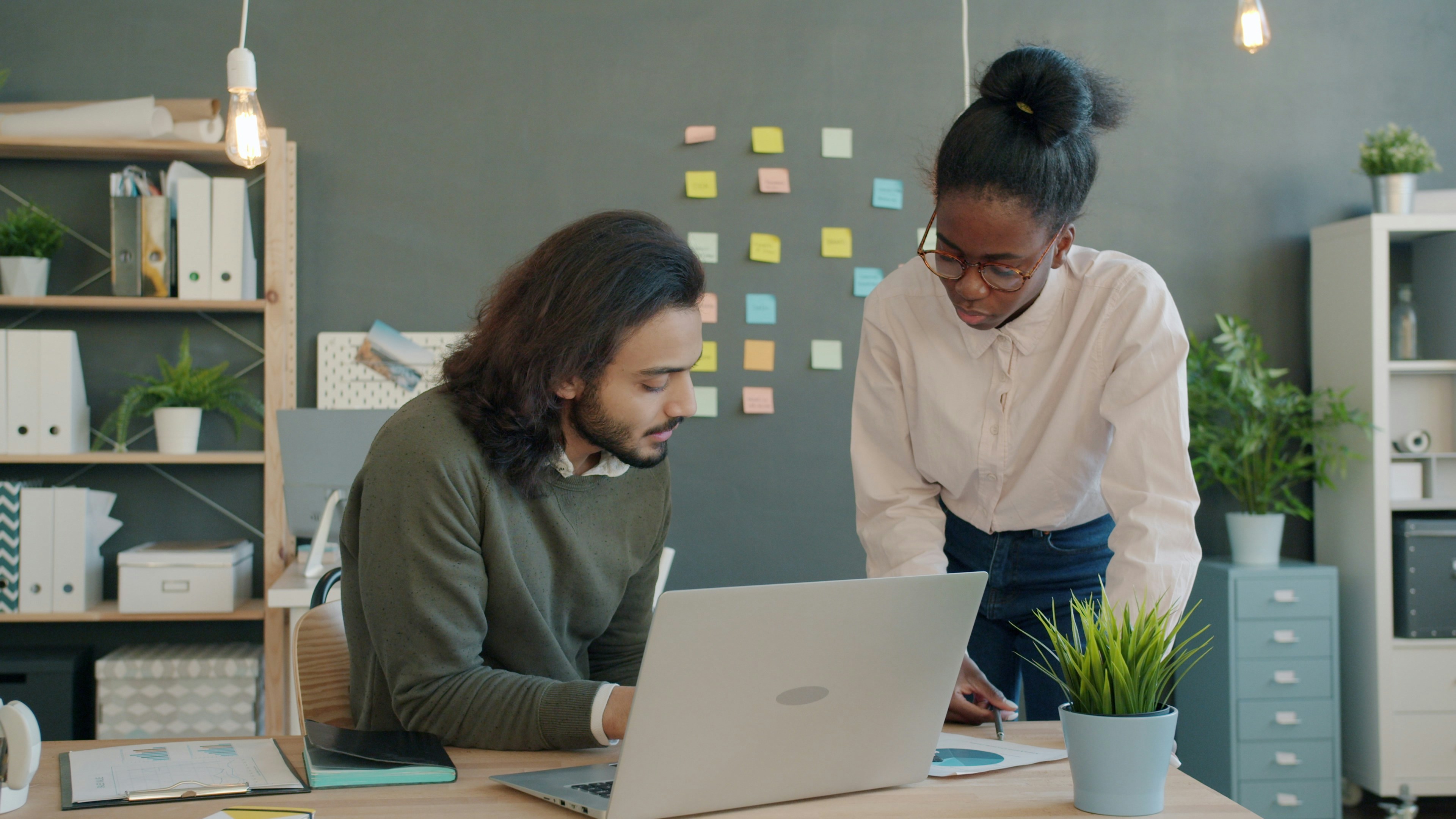 A team of diverse entrepreneurs collaborating on a startup project in a modern office.