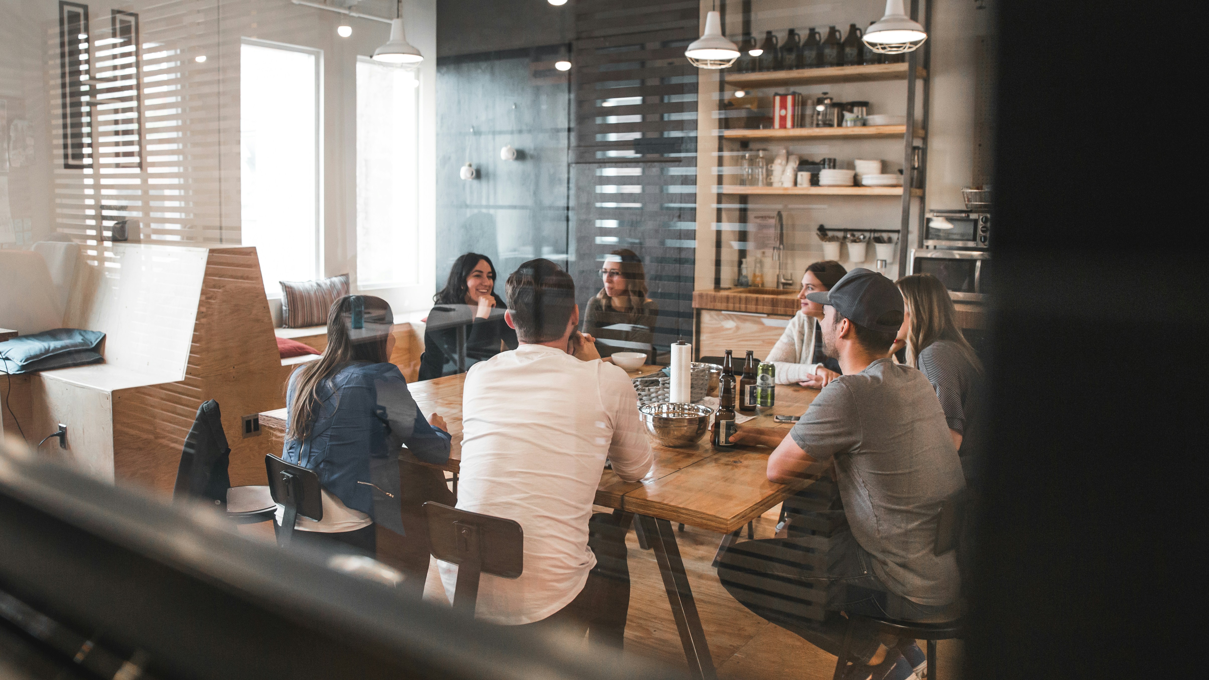 A team of business professionals in a meeting, analyzing financial charts.