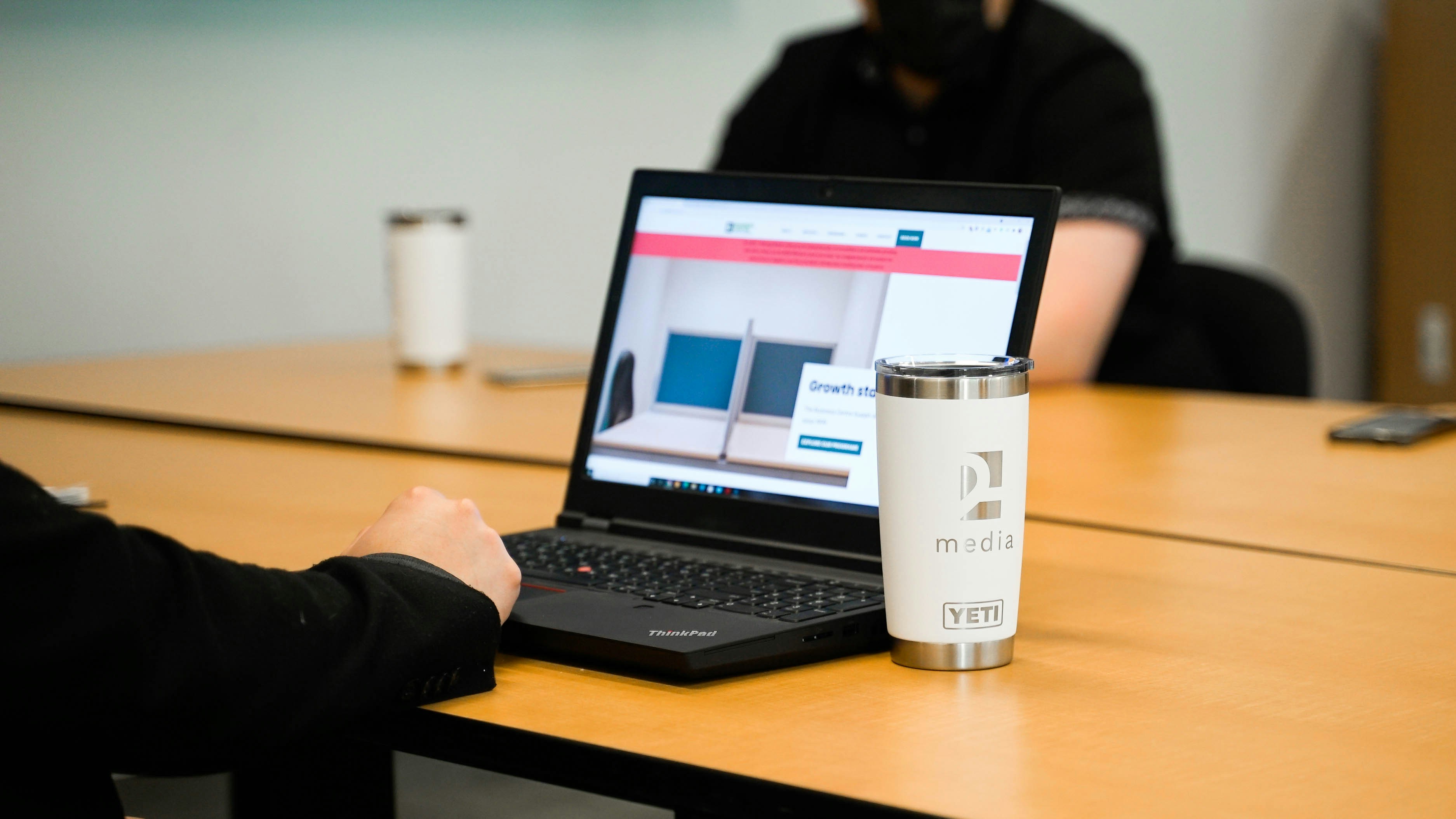 A modern technology office environment with professionals at work.