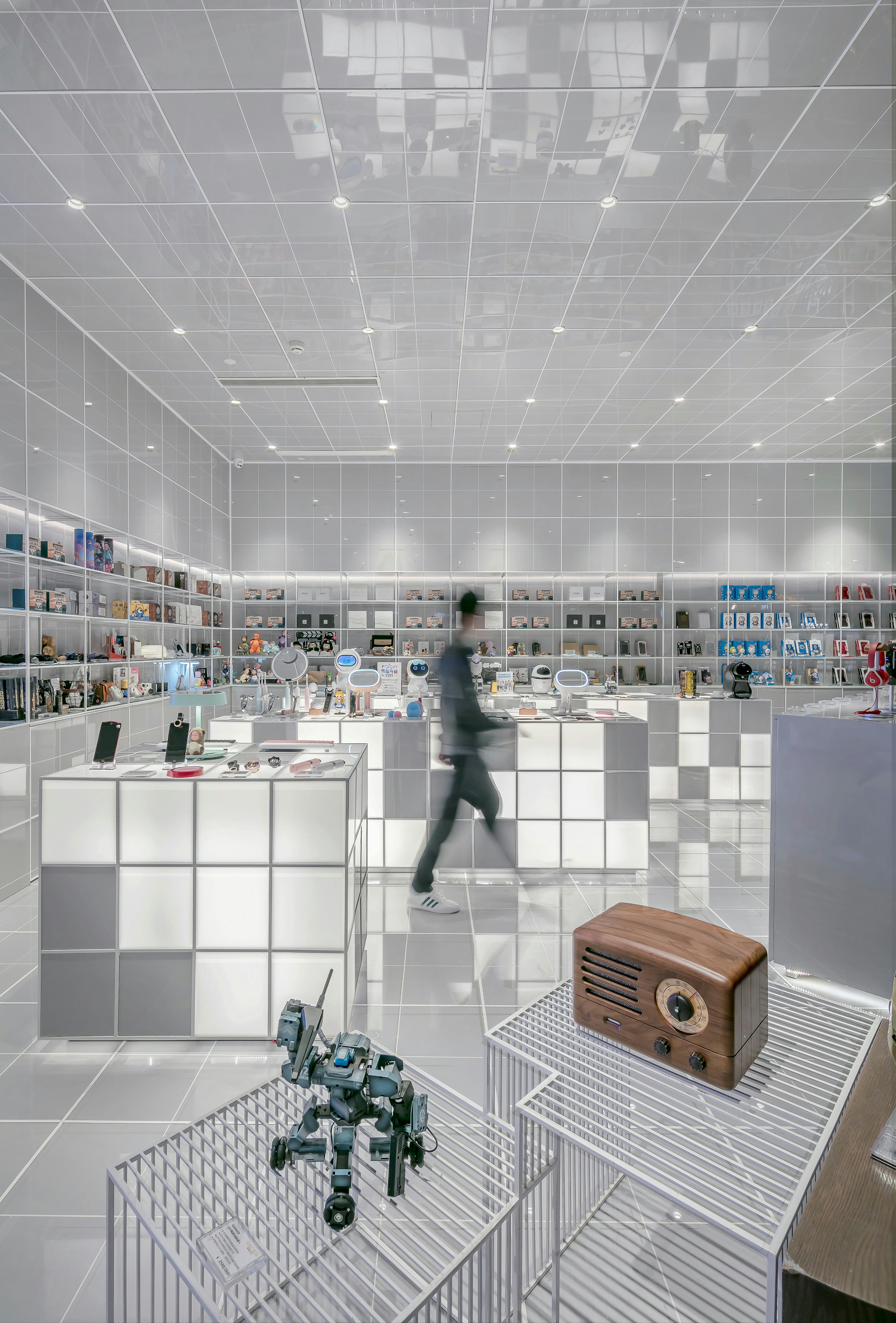 A modern retail storefront blending digital displays with physical products.