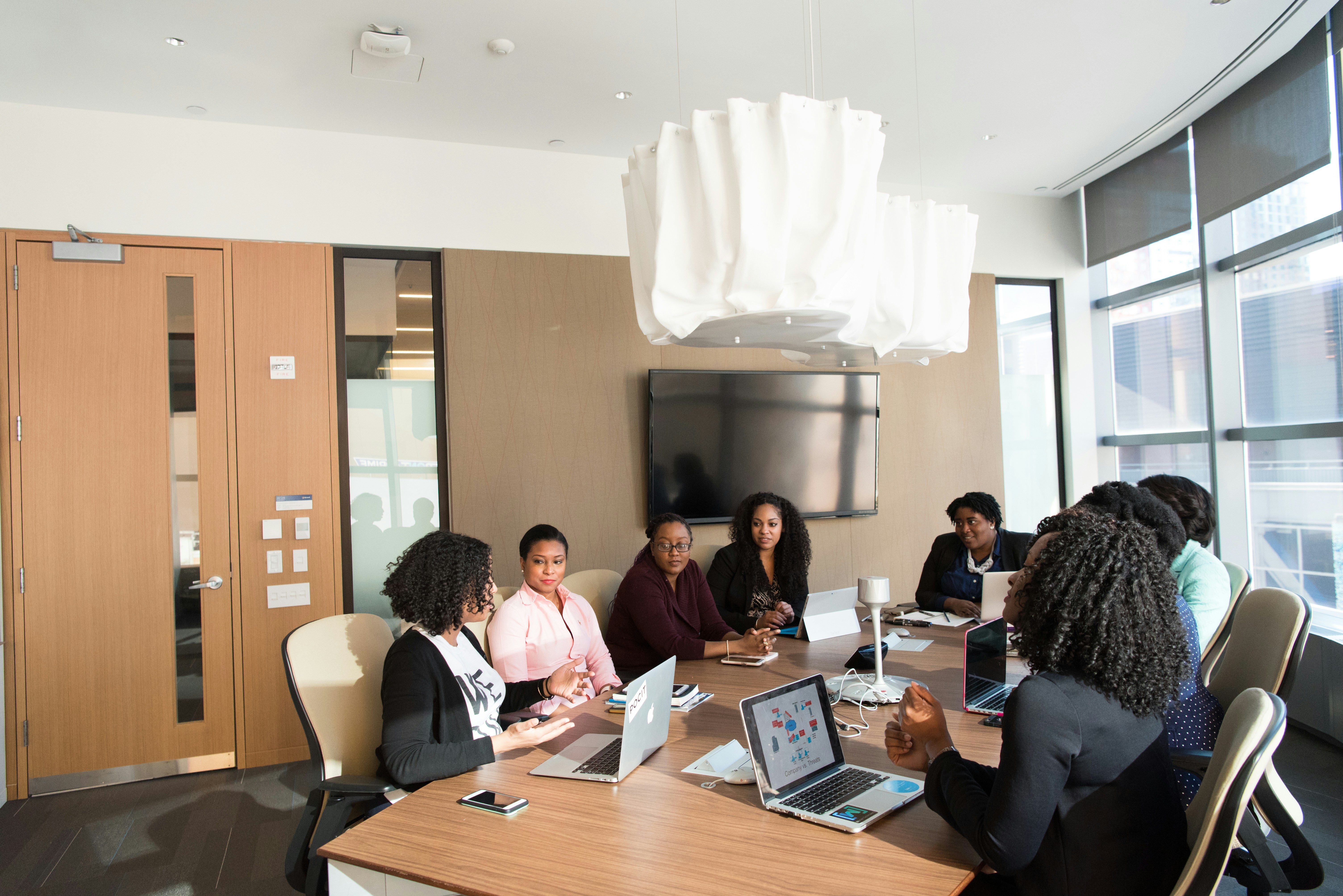 Team of technology developers working on an AI project in a modern office