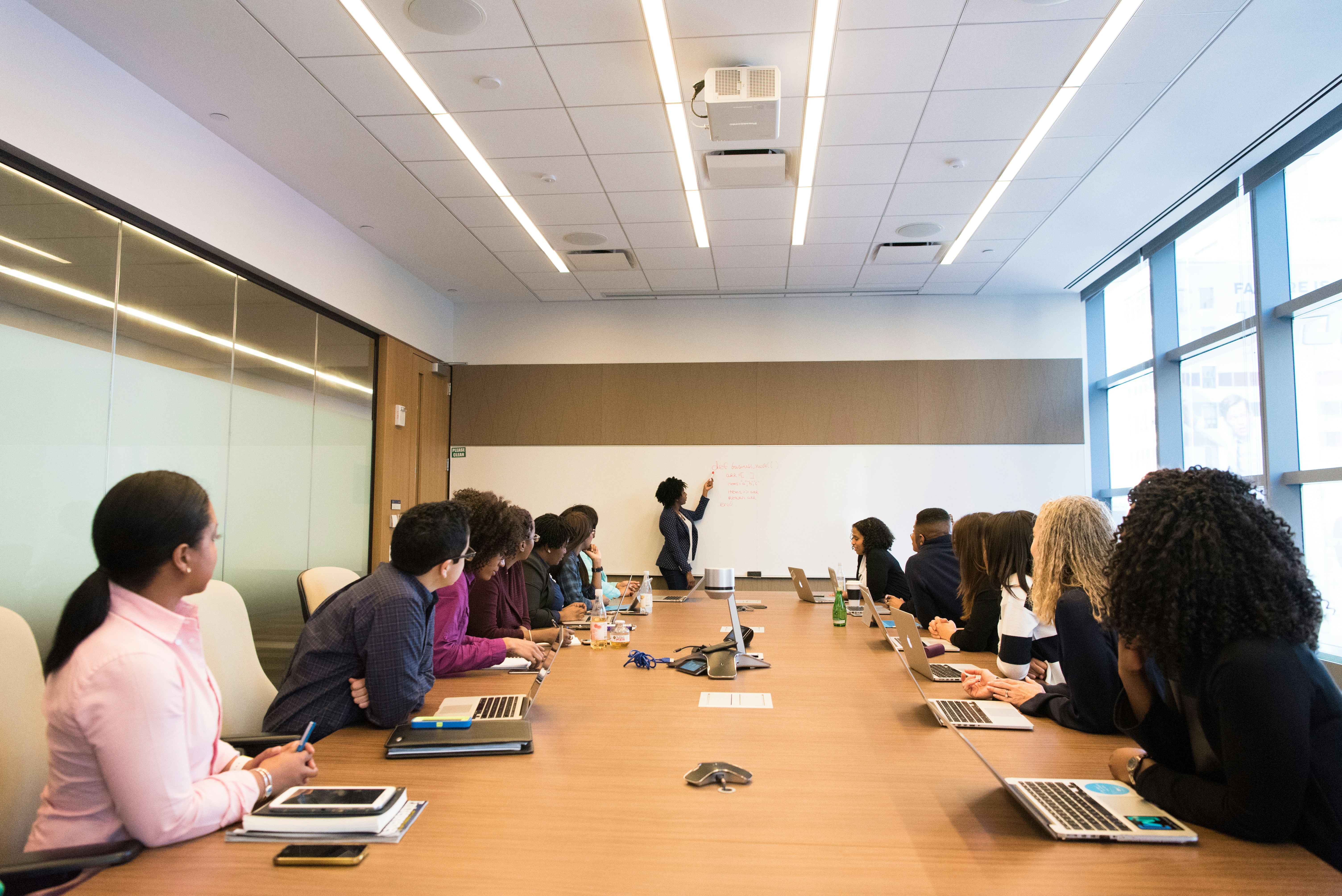 Business leaders in a modern office discussing growth strategy